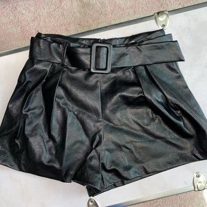 black leather shorts with buckle